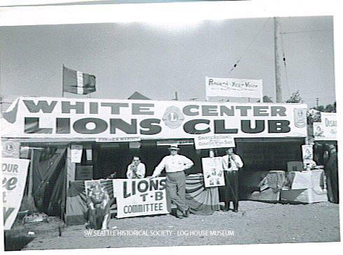 Elie LeDuc and Ernie Wolfe at the White Center Lions Club booth during the Mardi Gras festival in White Center, September 1948 SWSHS 2005.001.0396-AB