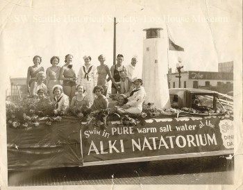 A parade float promoting the Alki Natatorium with famous swimmer Helene Madison seated on the left