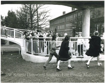 Cooper School students in Youngstown crossing the new pedestrian overpass bridging busy Delridge Way.